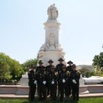 Honor guard in front of a monument