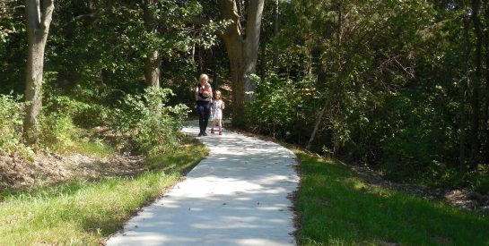 Mother walking with her two kids on Cosmo-Bethel Lake Trail.