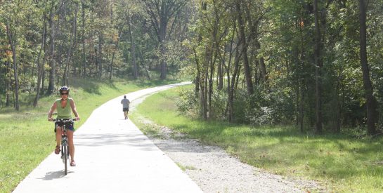 Biking and walking on Hominy Creek Trail.