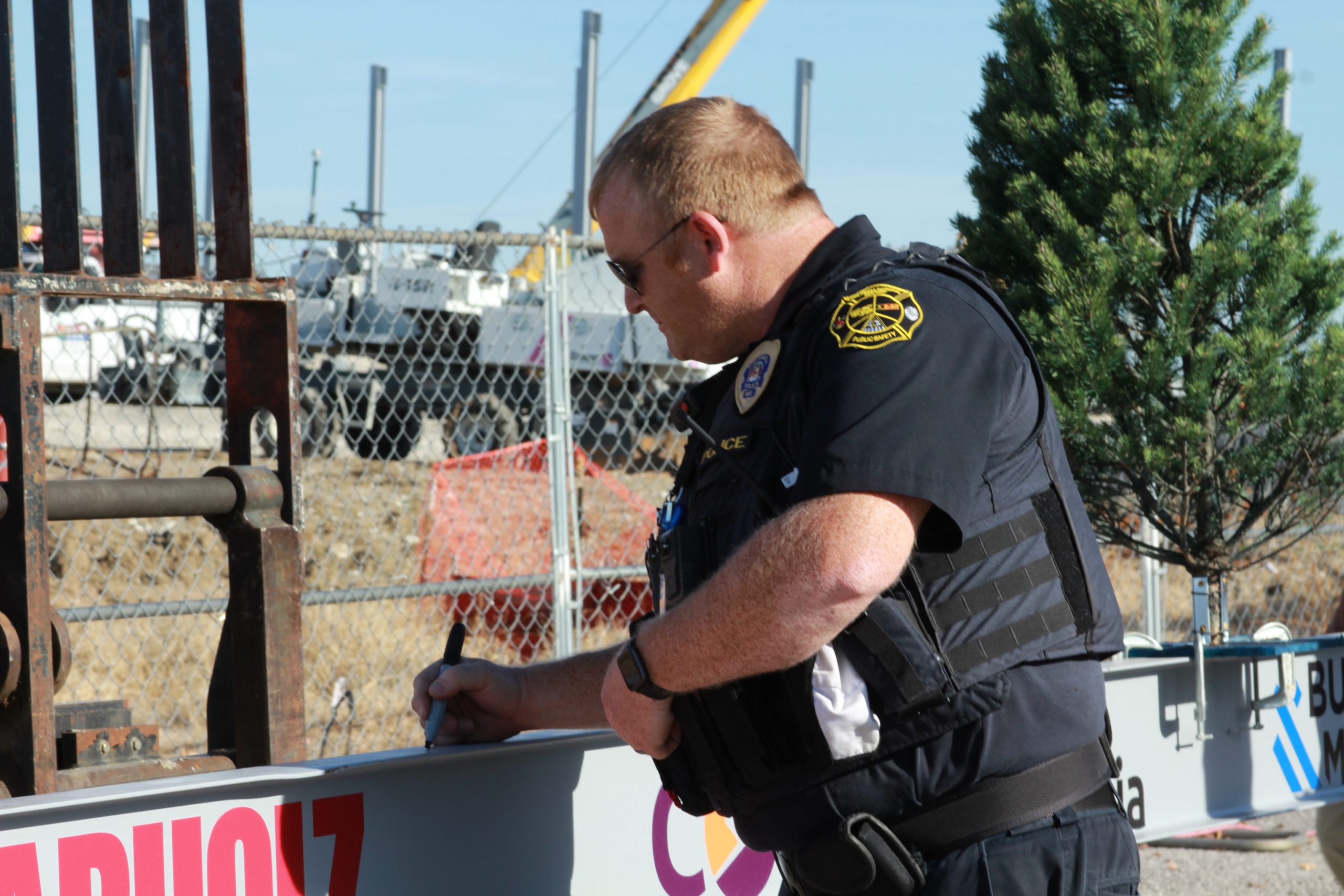 Police officer signing the beam