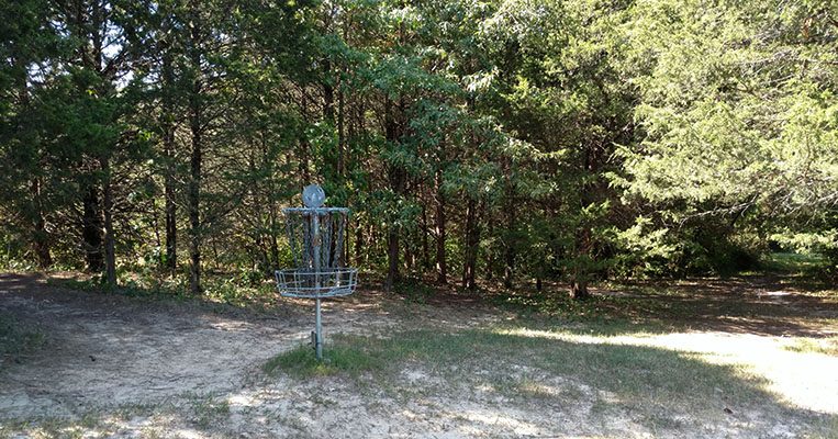 Indian Hills Disc Golf Course Disc Basket Shaded by Trees
